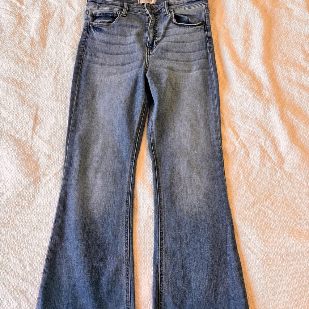 Blue Boot Cut Jeans with Distressed Details